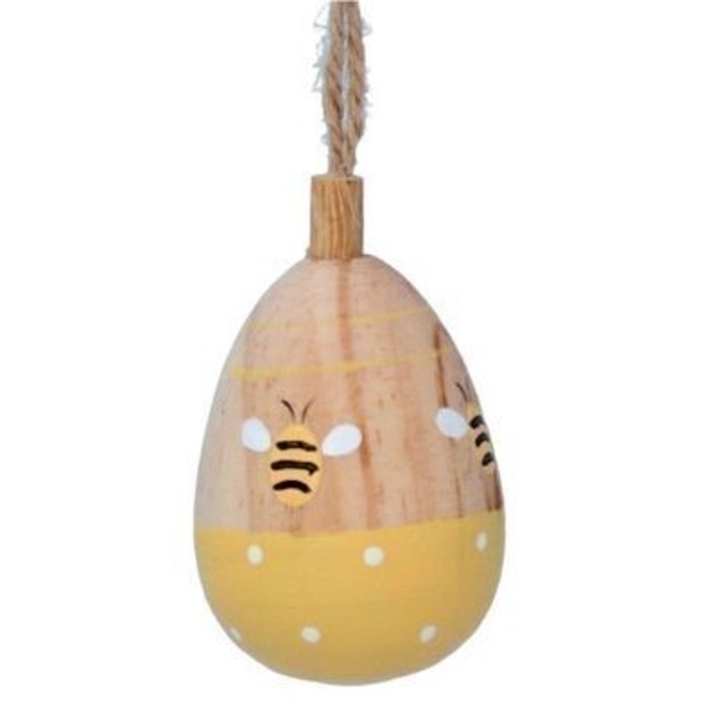 Bee Wooden 3D Decoration By Gisela Graham Natural wooden egg shaped hanging decoration with bee and yellow polka dot detail. The perfect addition to your home for Easter and Spring. By Gisela Graham.